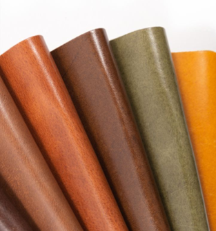 A close-up of different colors of leather

Description automatically generated