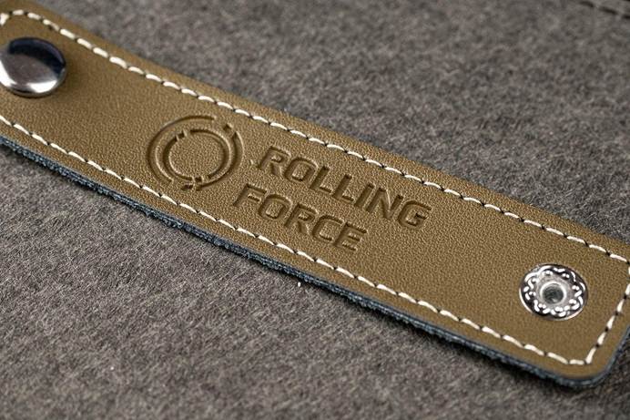 A leather strap with a logo on it

Description automatically generated