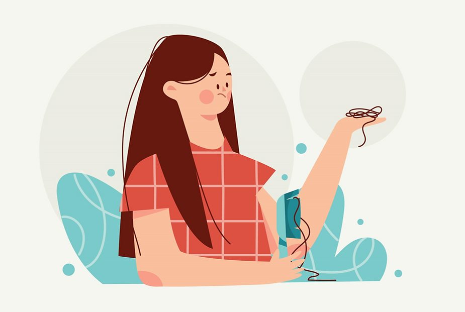 A female holding her lost hair's