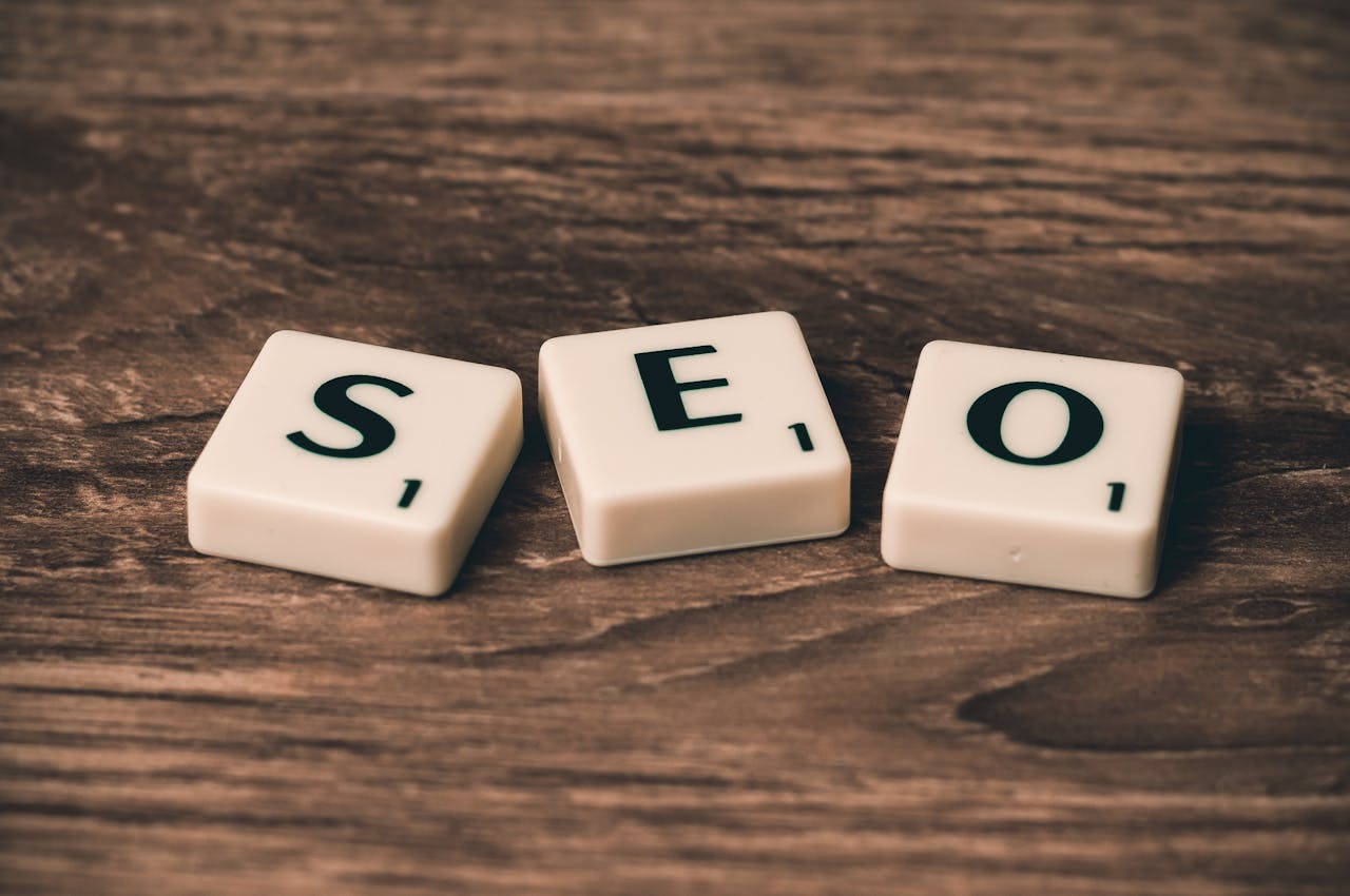 An image with a word "SEO" in a wooden background