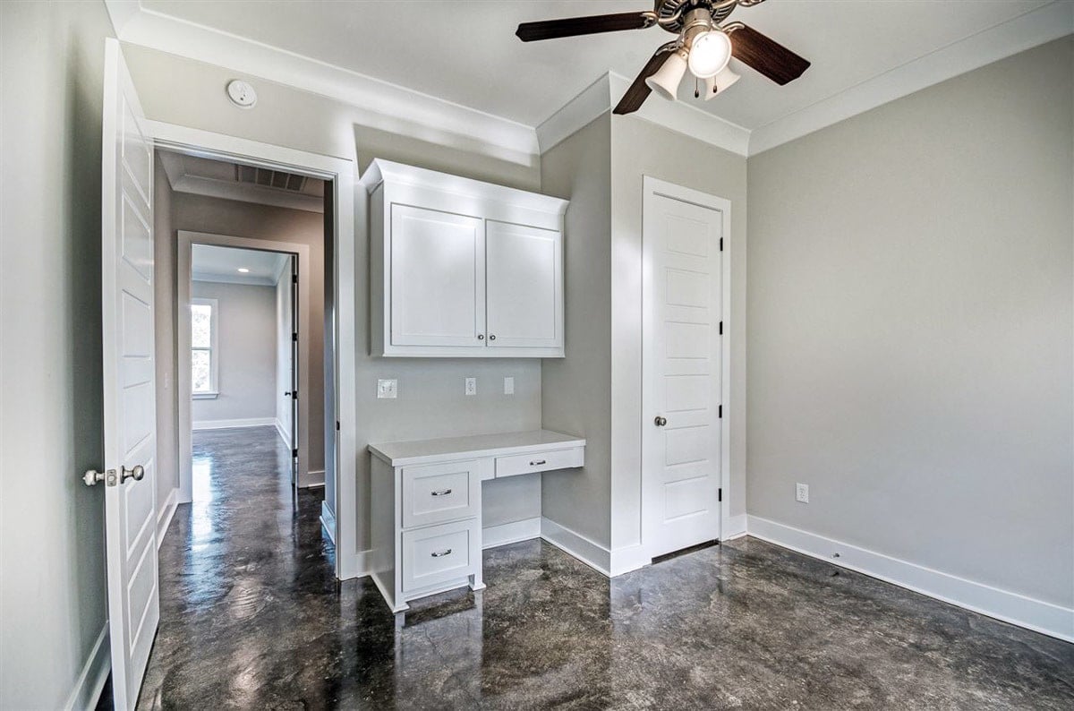 The bedroom includes a built-in desk and walk-in closet.