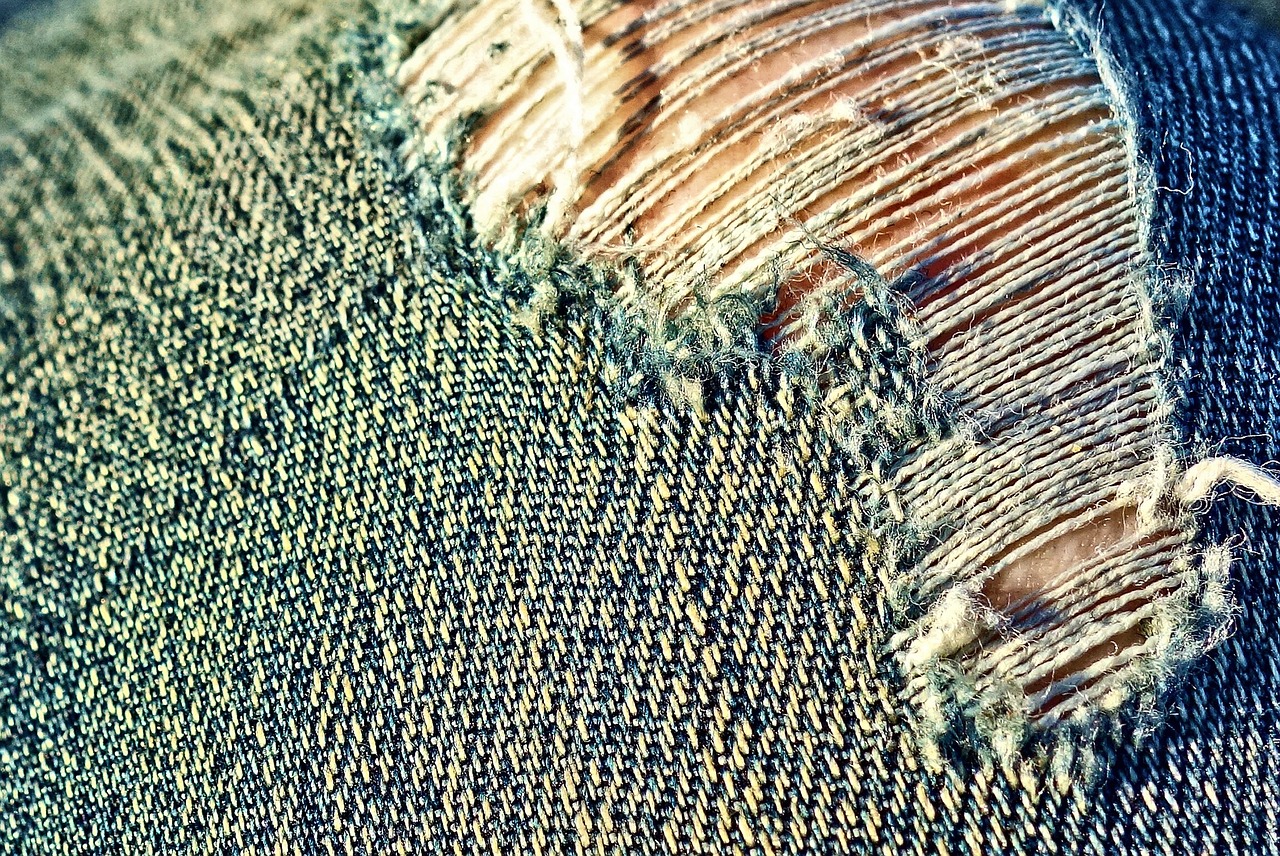 A close up of ripped jeans. 