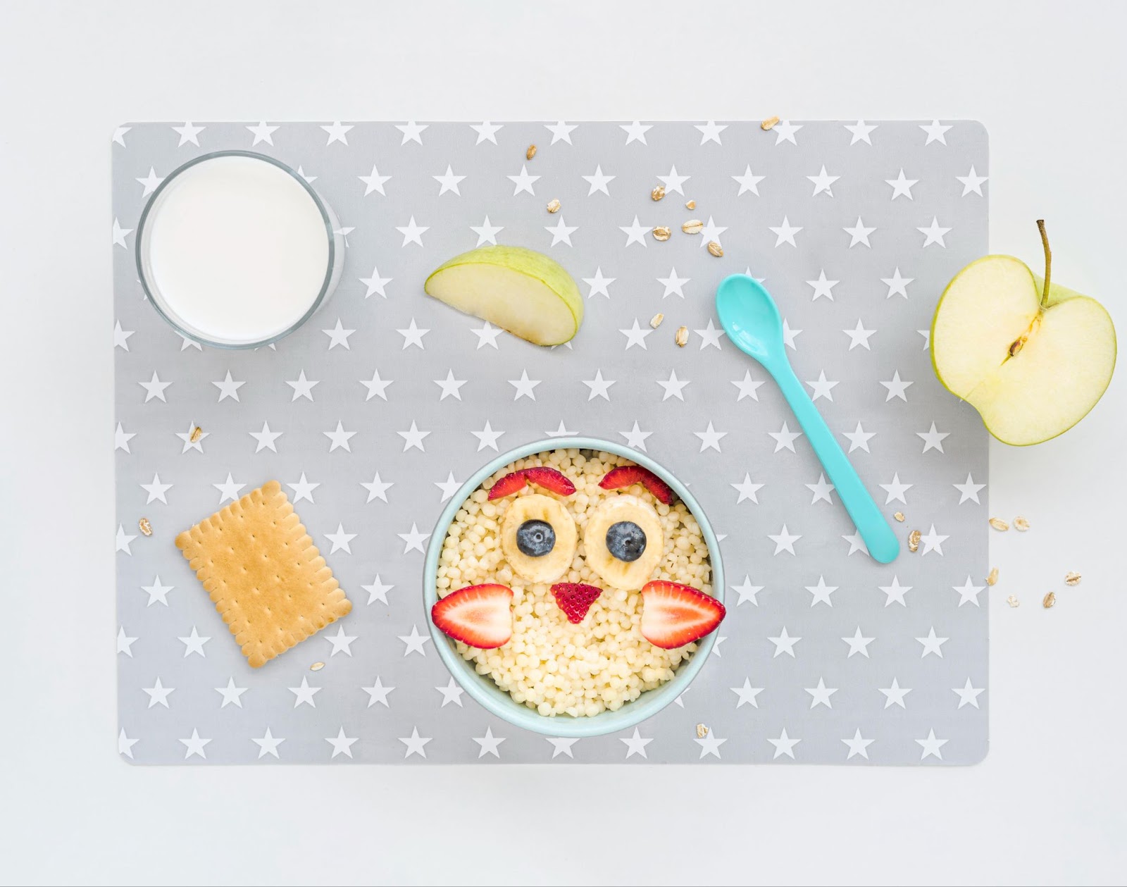 Baby in food in a place mat