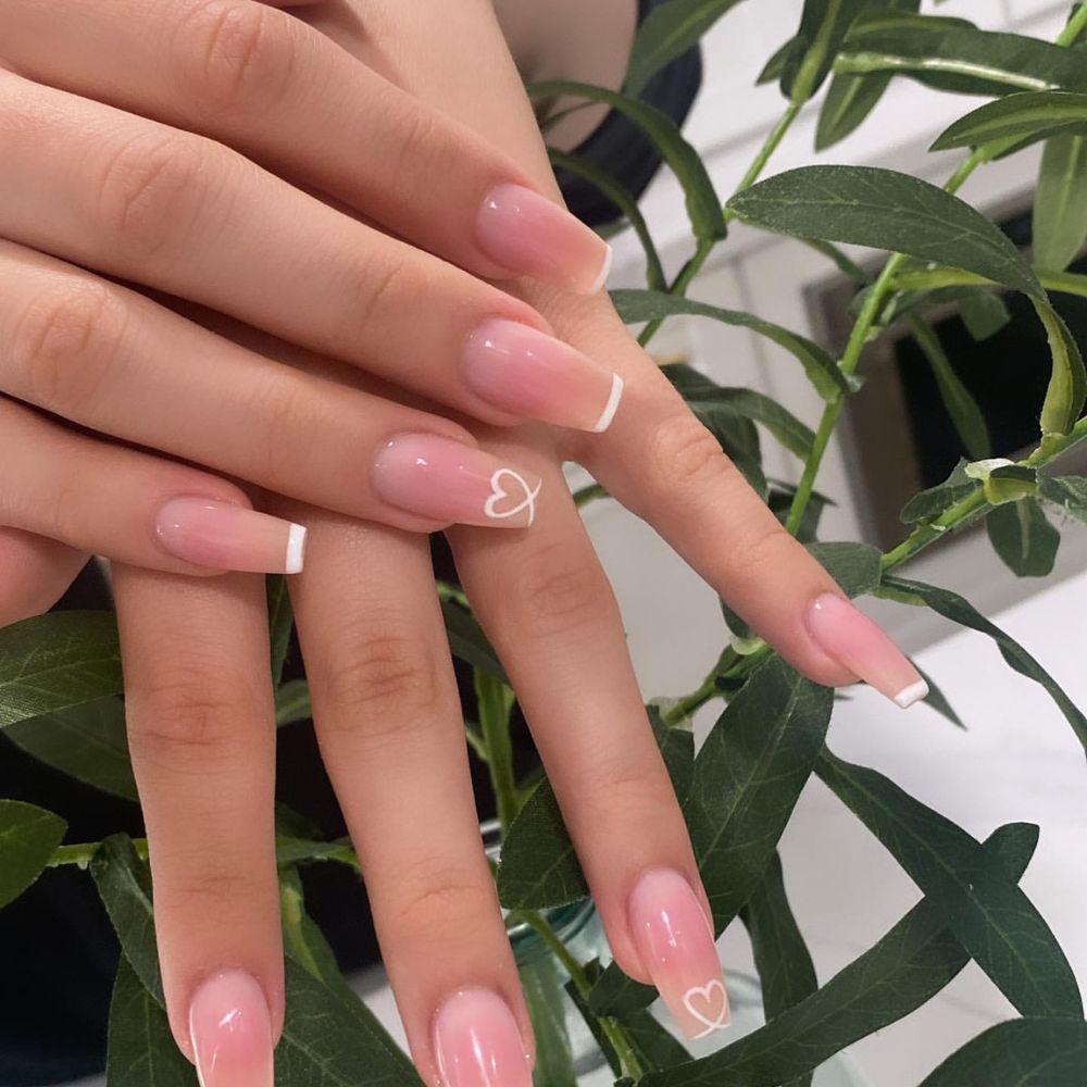 Close up of nails with simple pink nail designs having Clear Pink Nails