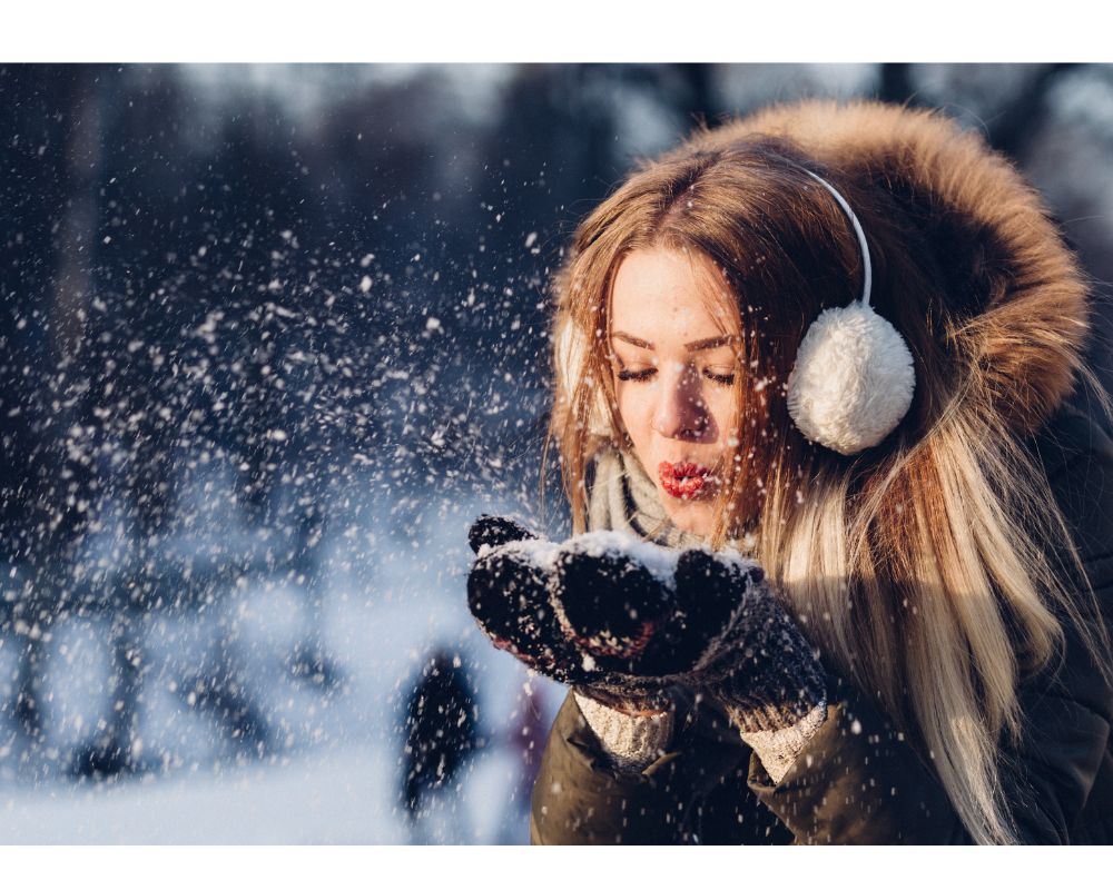 Girl Blowing Snow