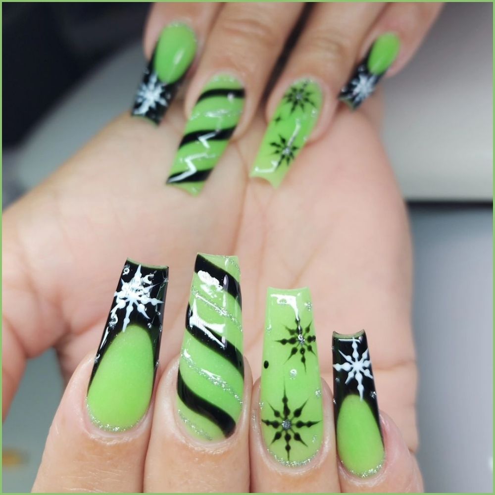 Close up of hands with Christmas Green Nails having  Festive Glow-in-the-Dark Green