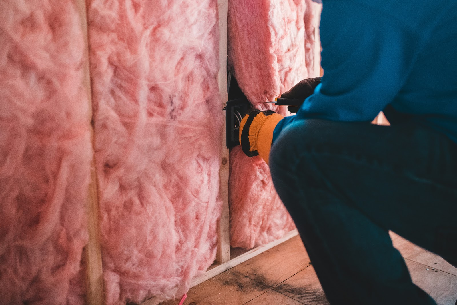 Insulation being installed in an attic