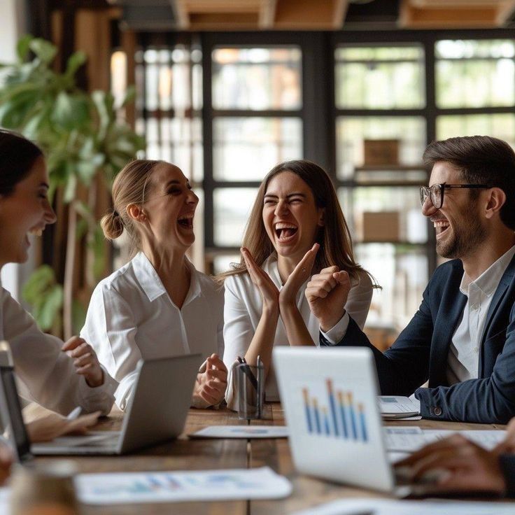 A group of workers in the midst of a laughter moment