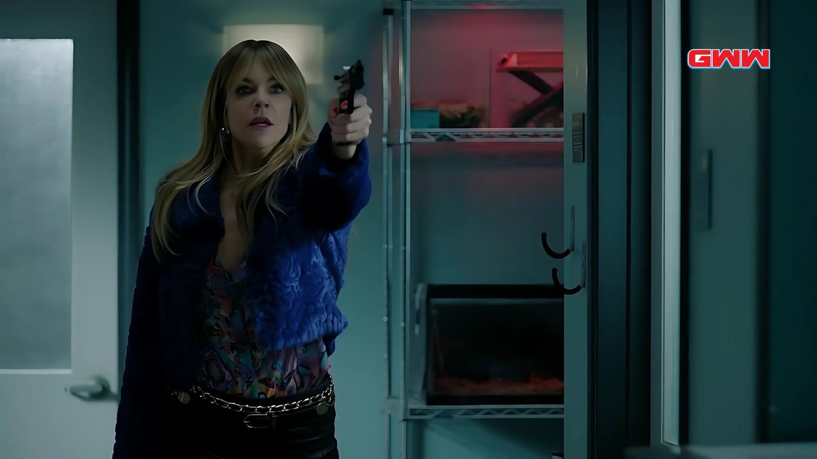 Kaitlin Olson as Morgan Gillory holding a gun in High Potential Season 1