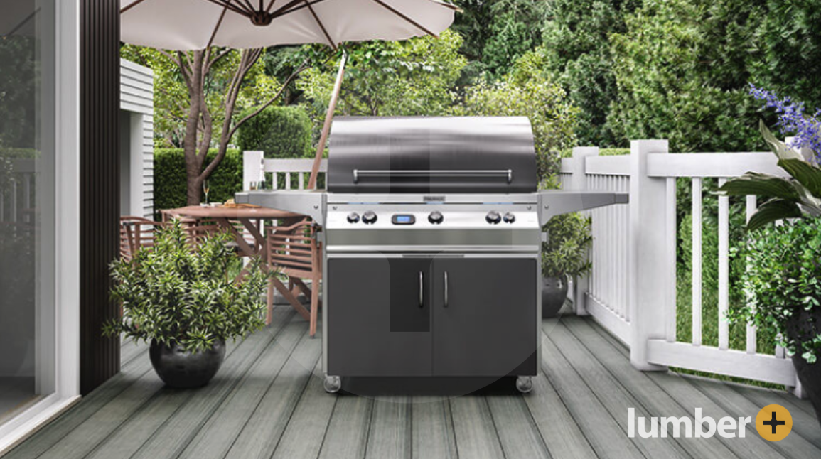  Outdoor grill sitting on a light gray wooden deck with white railing.
