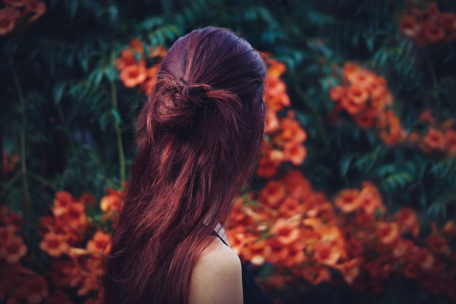 Woman strolling in a beautiful garden