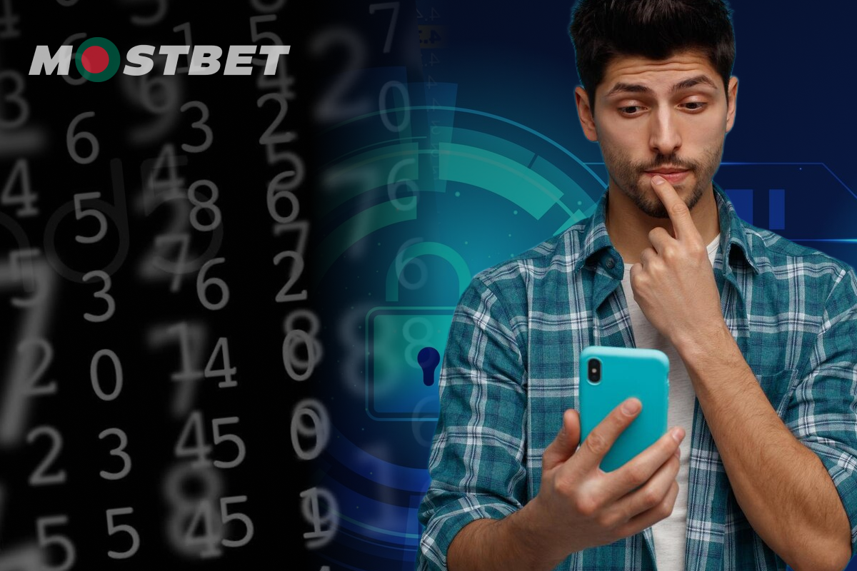 A man gazes intently at his phone, displaying various numbers on the screen