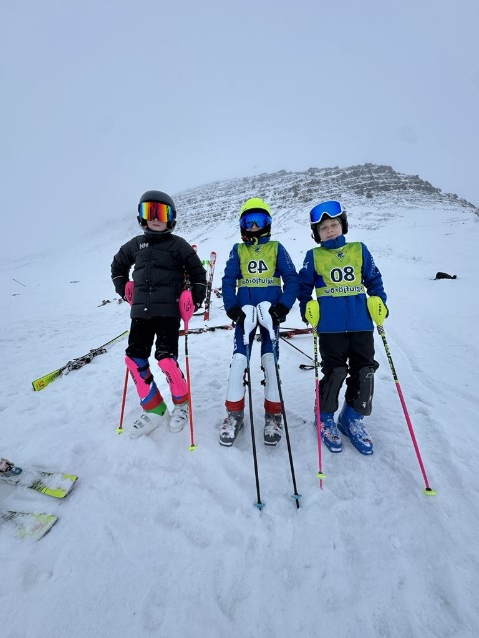 A group of kids on skis
AI-generated content may be incorrect.