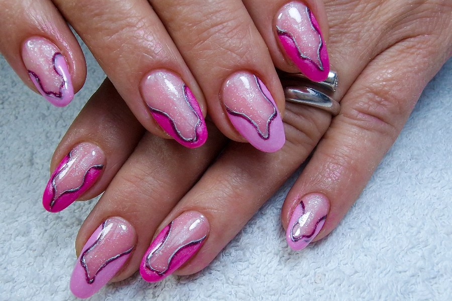 Swirl tips bring movement and creativity to a modern French nail tip design.