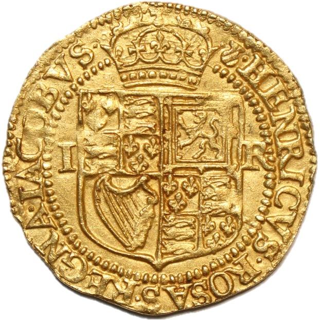 A gold coin with a crest and a crown

Description automatically generated