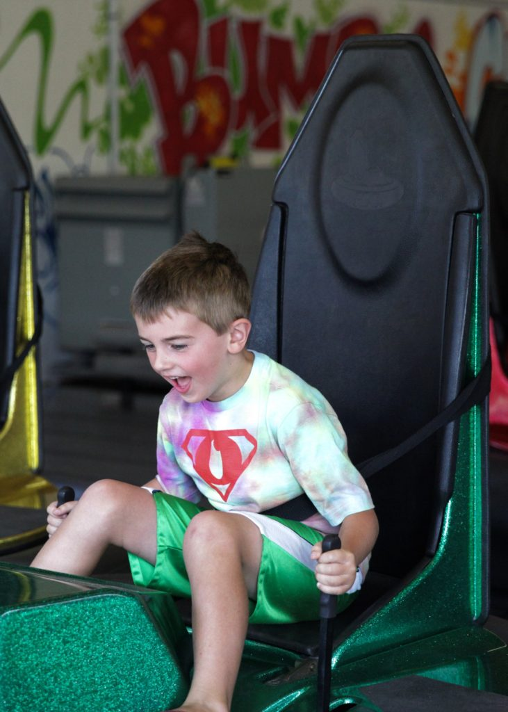 A young boy sitting in a bumper car at the Salem Willows Arcade.