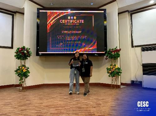 May be an image of 2 people, television, lighting, speaker, dais and text