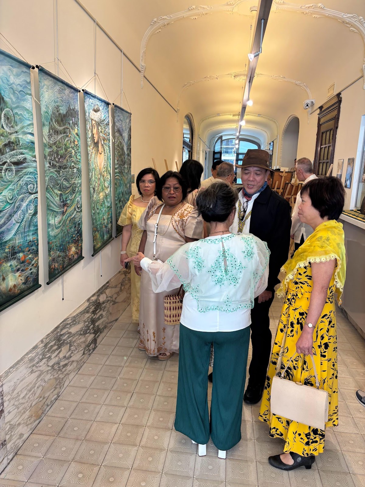 A group of people standing in a hallwayAI-generated content may be incorrect.