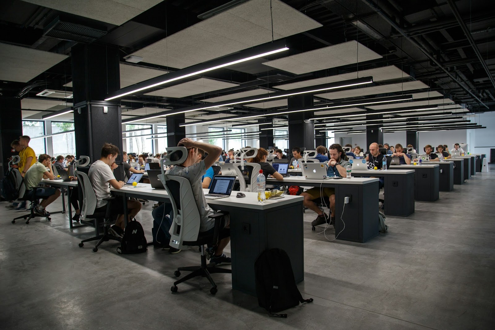 A bustling modern office filled with professionals confidently engaged in an annual business review session