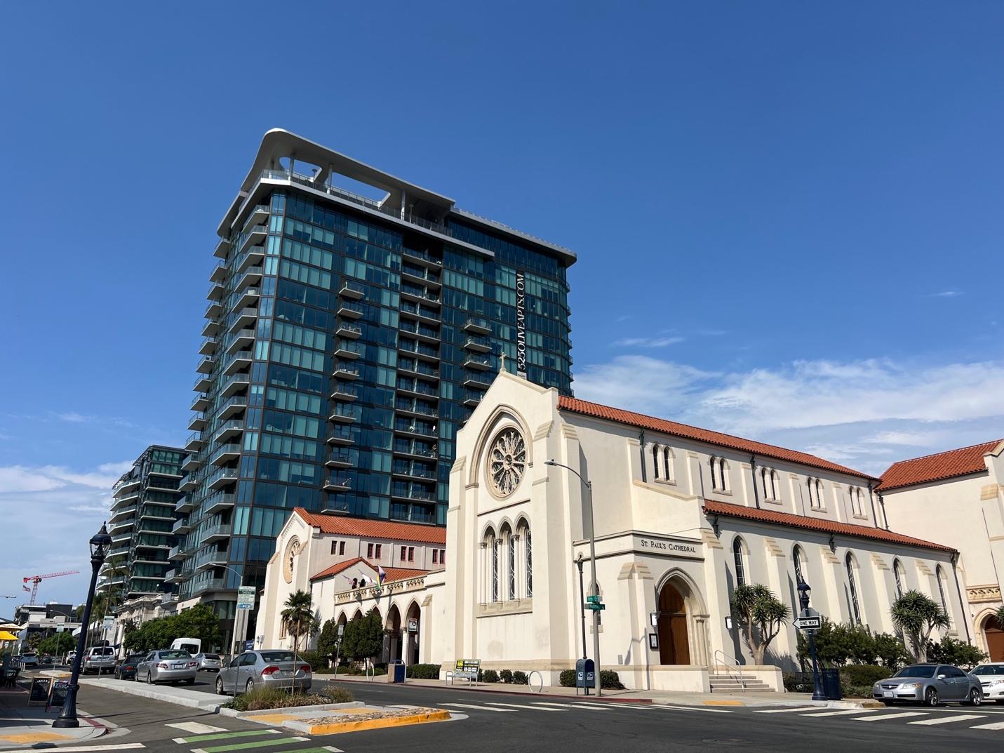 A building with a clock on the front

Description automatically generated