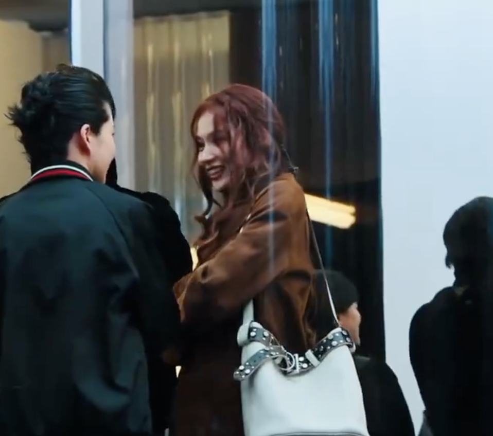 A picture of TWICE Sana and a man in PRADA Men's Fashion Week Fall/Winter 2025