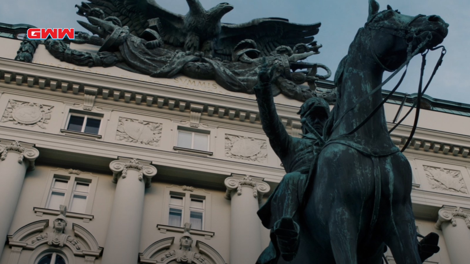 Close-up of a historic statue with intricate building details in Vienna