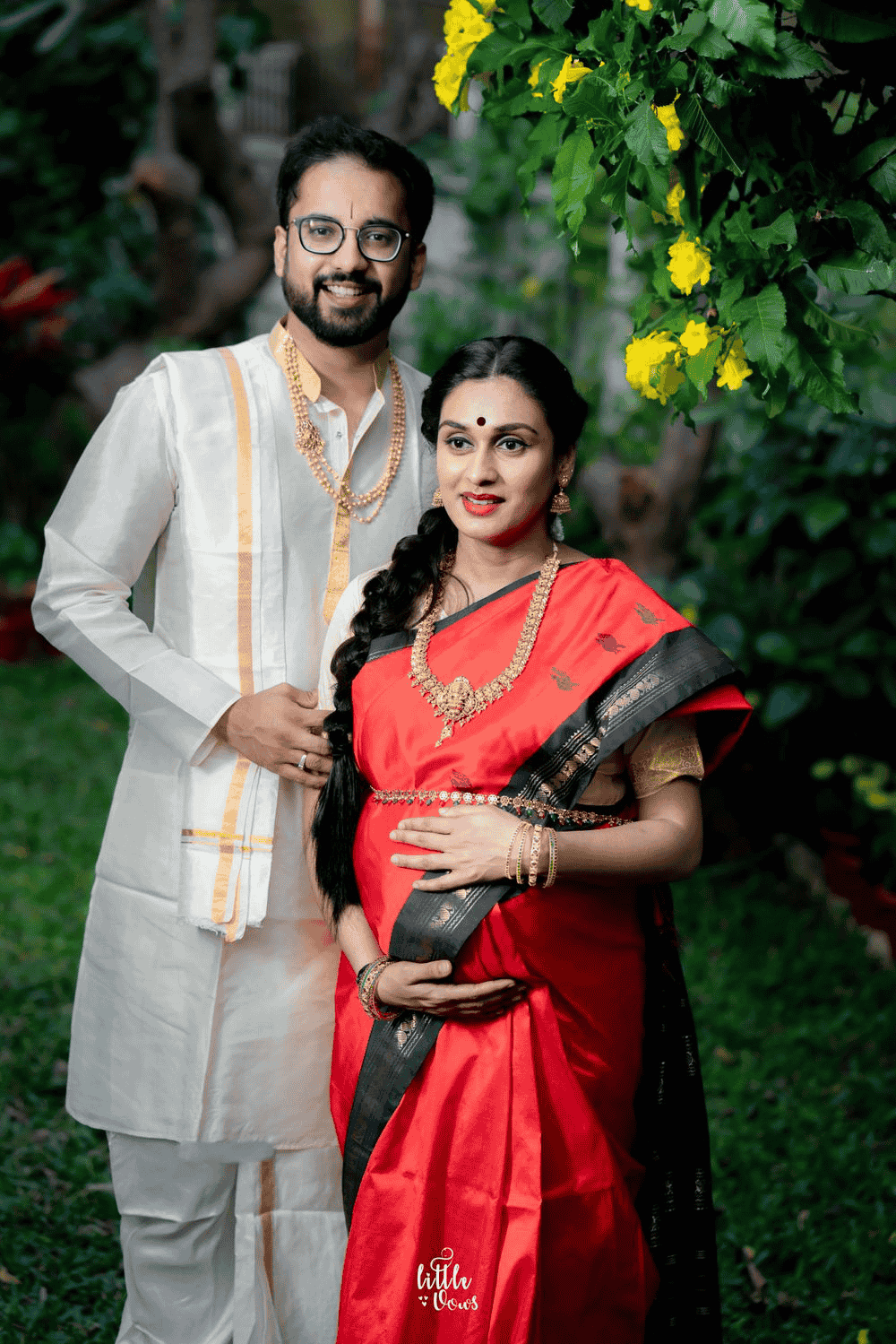 Nature-inspired maternity photoshoot showcasing a pregnant woman in a traditional setting