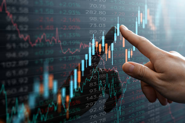 Candlestick chart and data of financial market. Analyst pointing the chart. stock chart stock pictures, royalty-free photos & images