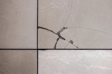 signs that you need a flooring replacement cracked tile floor custom built michigan