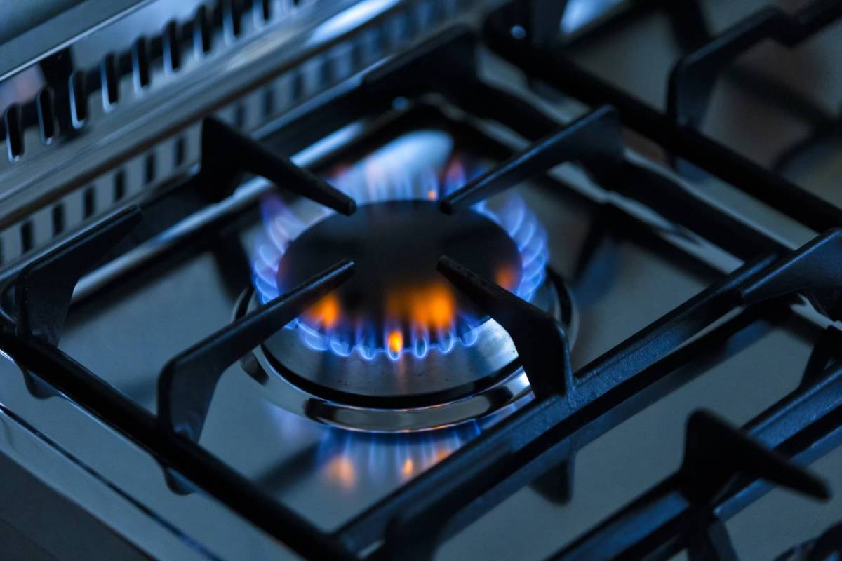 A gas burner on a stovetop