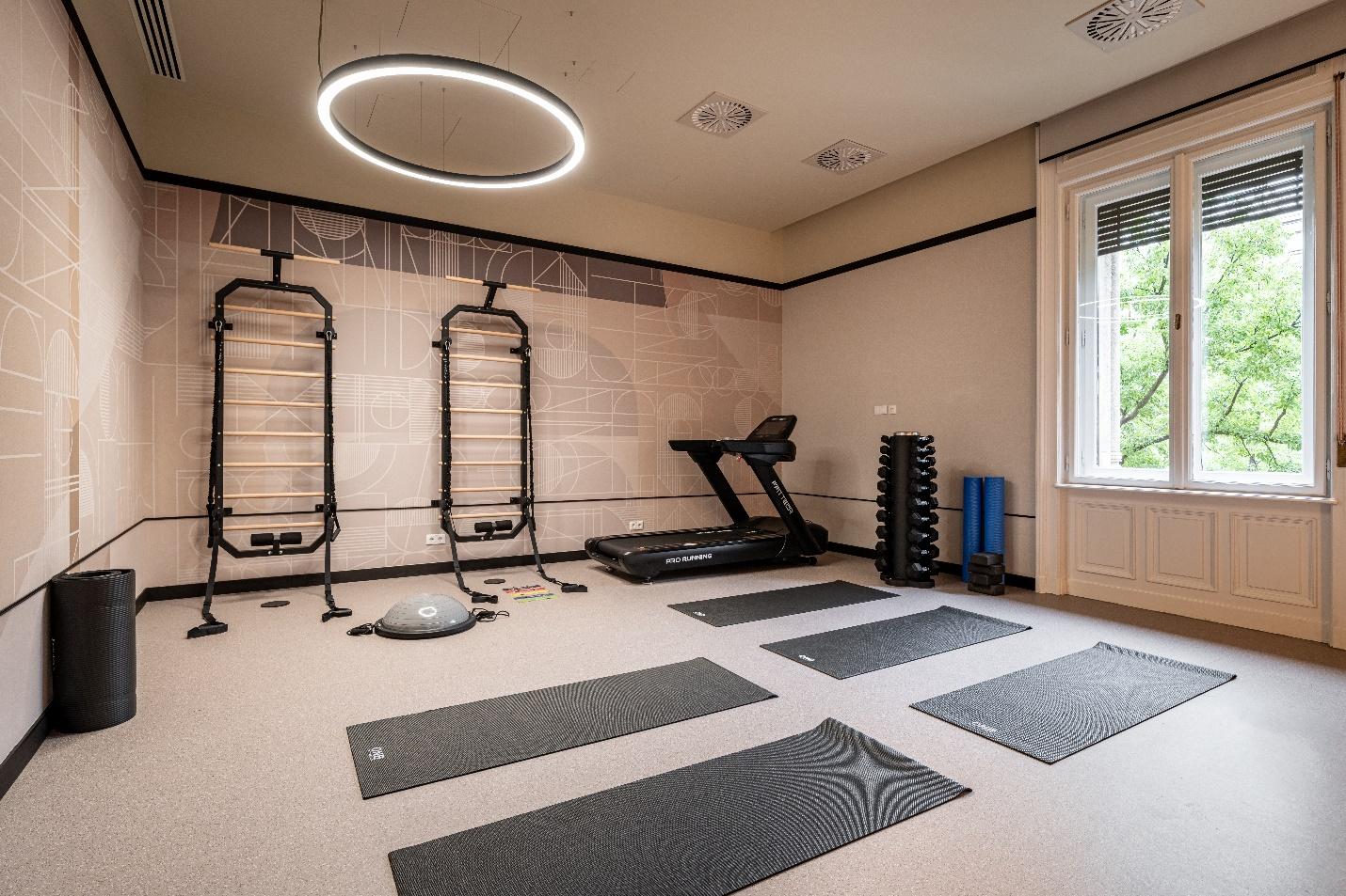 A room with exercise equipmentAI-generated content may be incorrect.