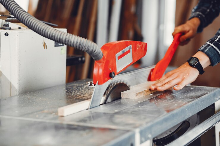 a man working with a ridgid 6-1/8 in. jointer/planer 