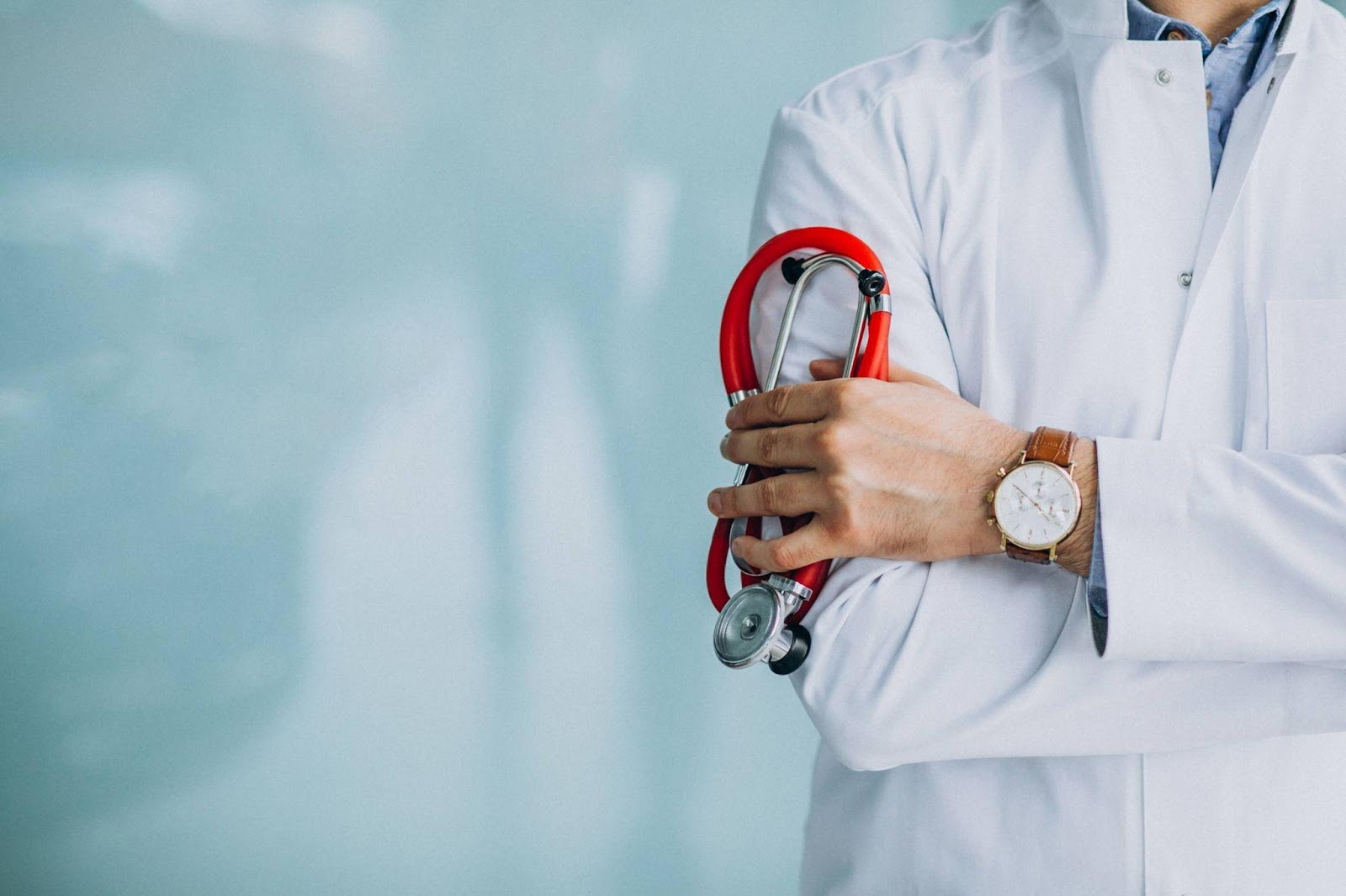 Malaysian doctor holding a medical stethoscope