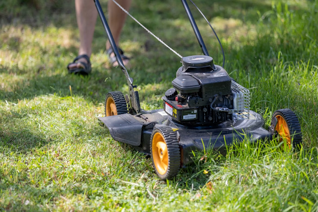 image of lawn mower cutting grass