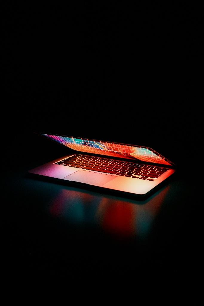 A computer with a colorful screenAI-generated content may be incorrect.