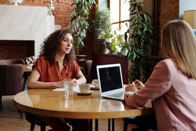 Two people in an interview at a coffee shop