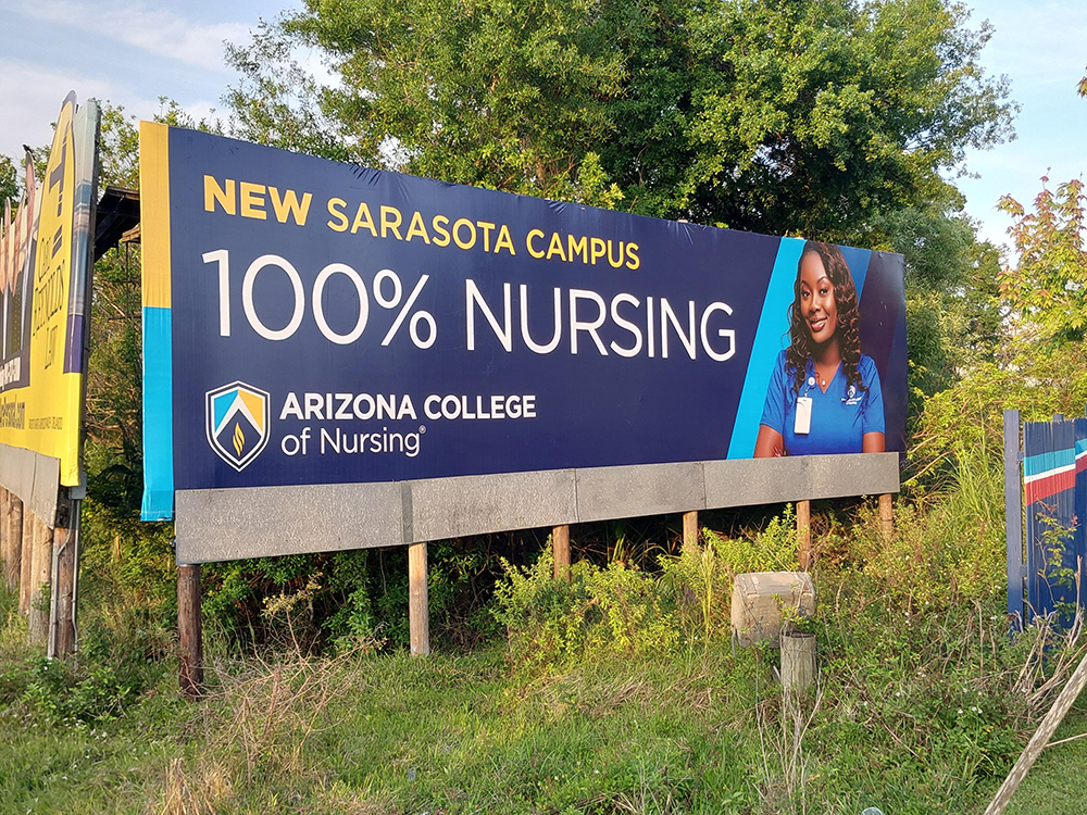 Billboard advertising Arizona College of Nursing  within trees