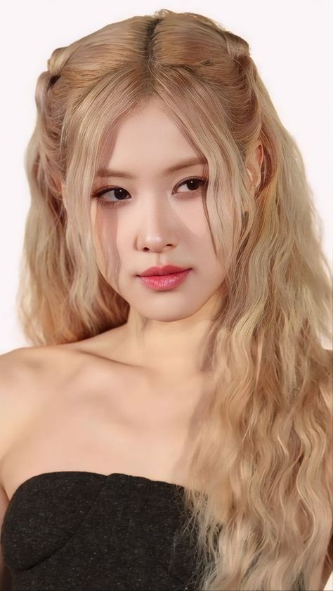 This contains an image of Rosé with long blonde hair wearing a strapless top and posing for the camera