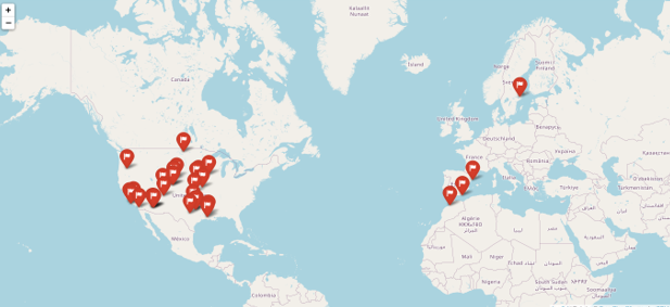 A map of the world with red pin pointsDescription automatically generated