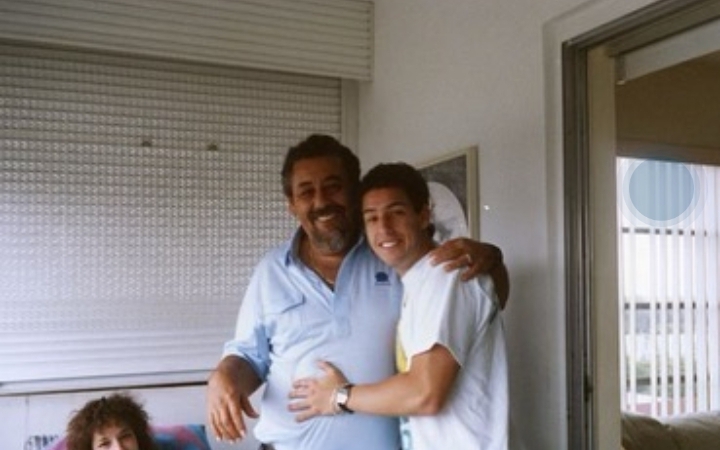 Stanley Sandler with his son smiling