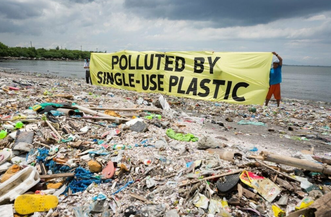 a beach polluted with plastic waste