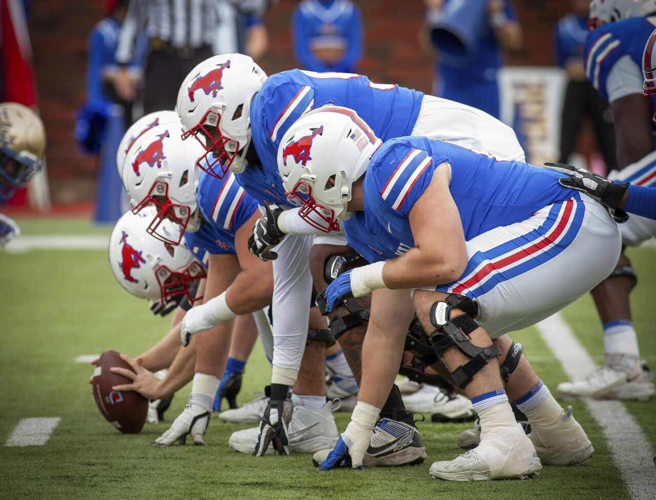 SMU's offensive line prepares to snap the ball.