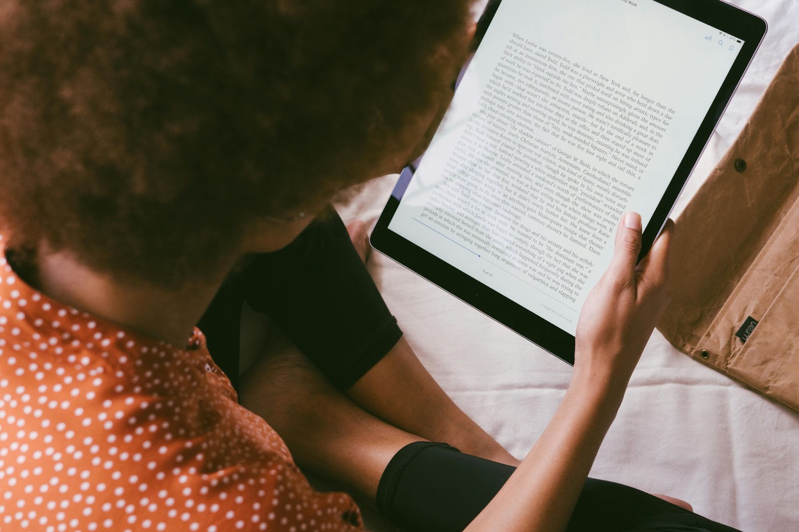 image of a lady reading content.