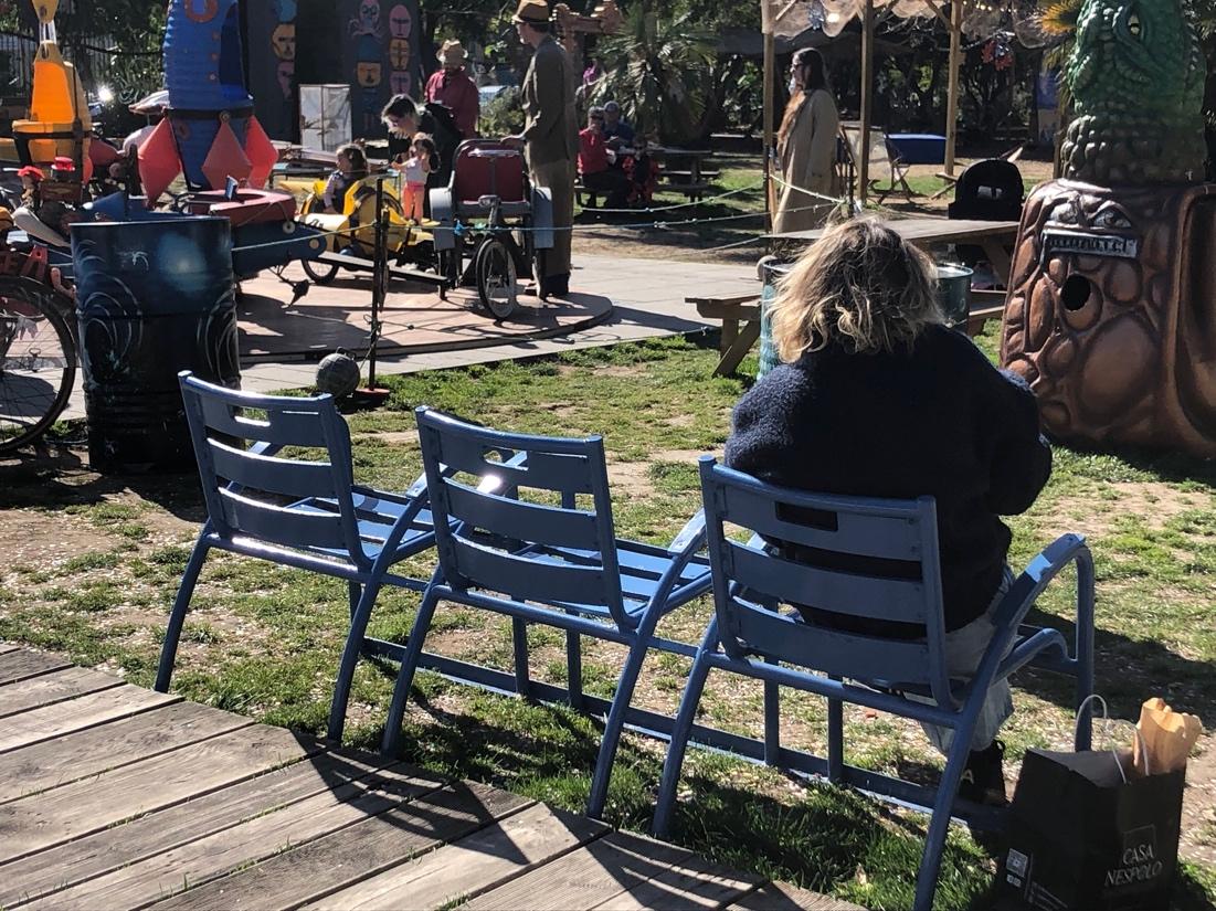 A group of people sitting on a bench

Description automatically generated