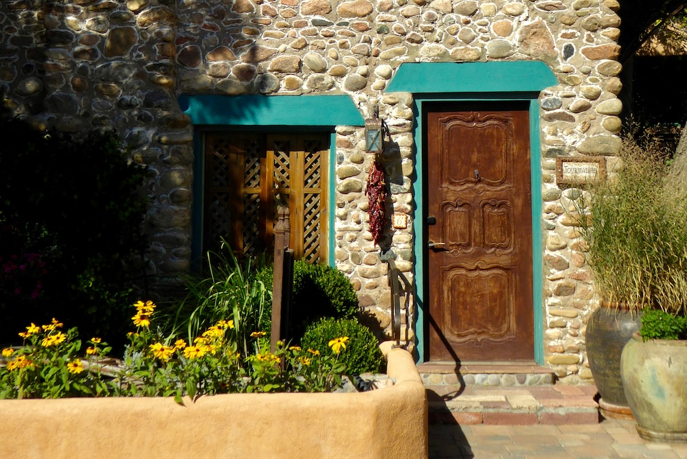 downtown Santa Fe home with a flower bed