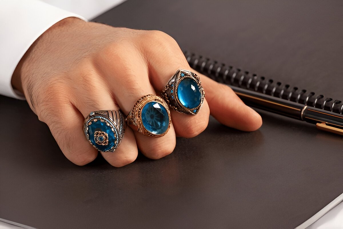 Man wearing Blue Gemstone Rings