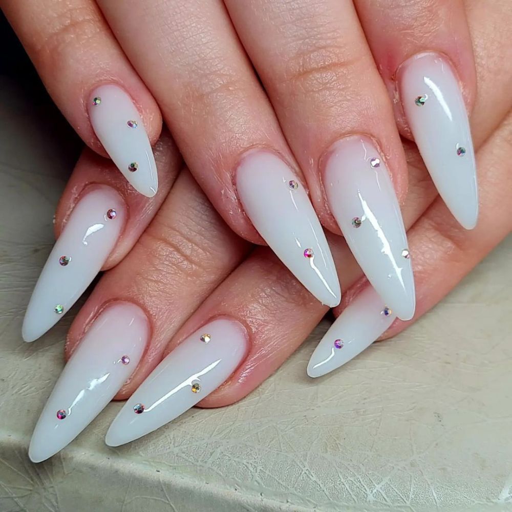 Simple White Nail Design having Milky white nails with diamonds