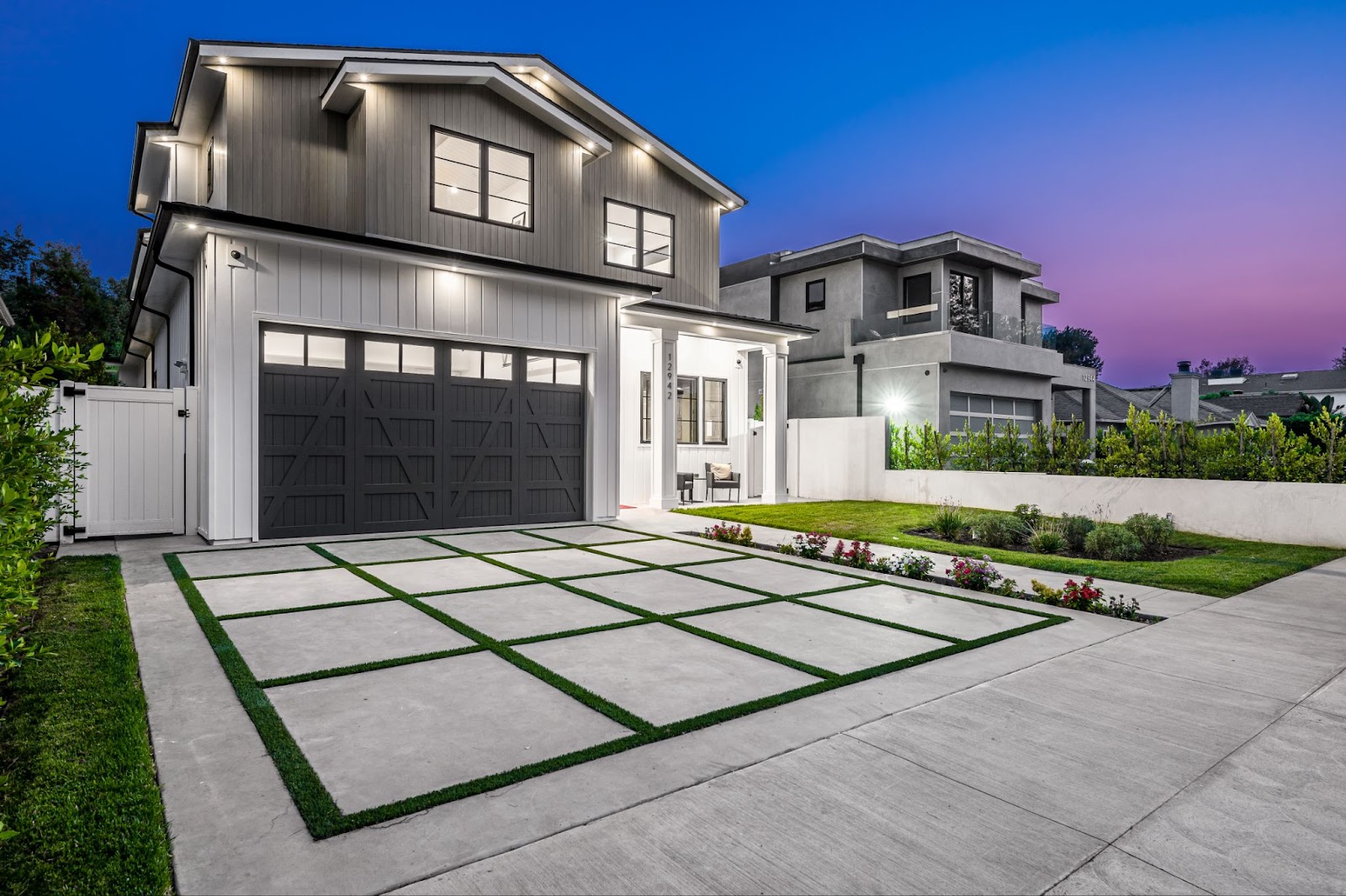 Contemporary home with a concrete driveway. 