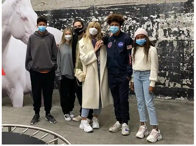 Johan Riley Fyodor Taiwo Samuel with his family wearing face masks