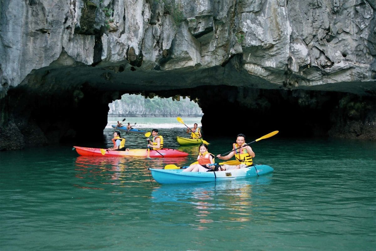 Halong-Bay-Kayaking-to-visit-Caves 12–DAY CHARMING VIETNAM FAMILY TOUR